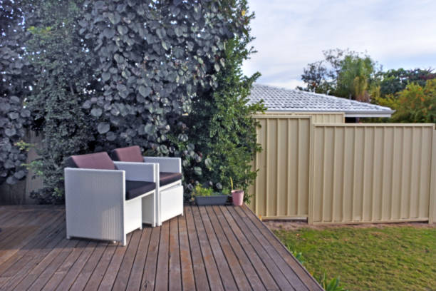 istock Two outdoor chairs on a home front yard garden deck 1250180219