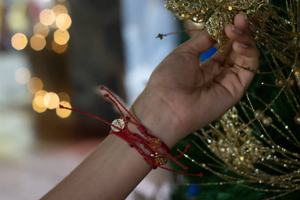 istock woman hand arranging christmas tree 1250181627