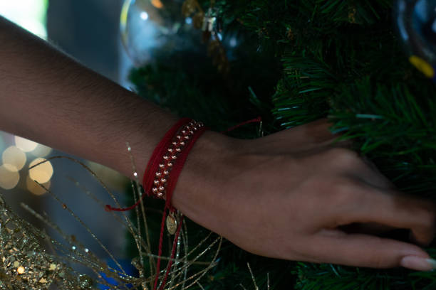 istock woman hand arranging christmas tree 1250181707