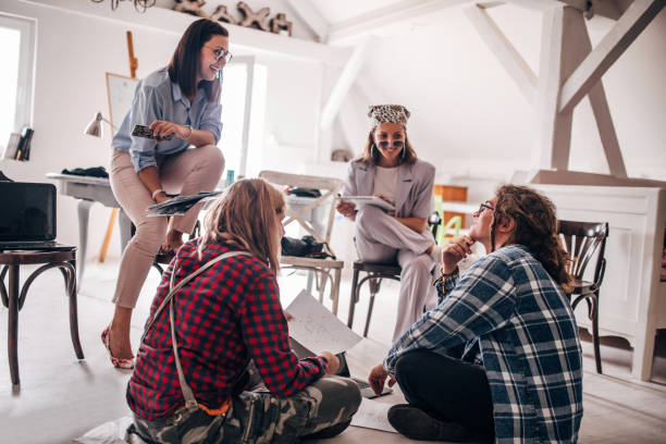 istock Team of young designers  cooperating in the office 1250182570