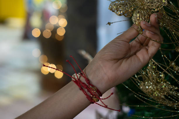 woman hand arranging christmas tree