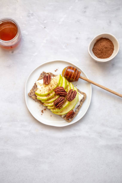 istock sandwich with apple, cream cheese and cheese on white marble background with copy space 1250184891