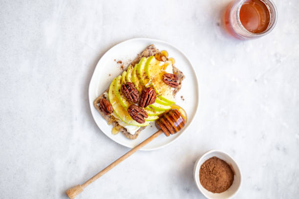 istock sandwich with apple, cream cheese and cheese on white marble background with copy space 1250184913