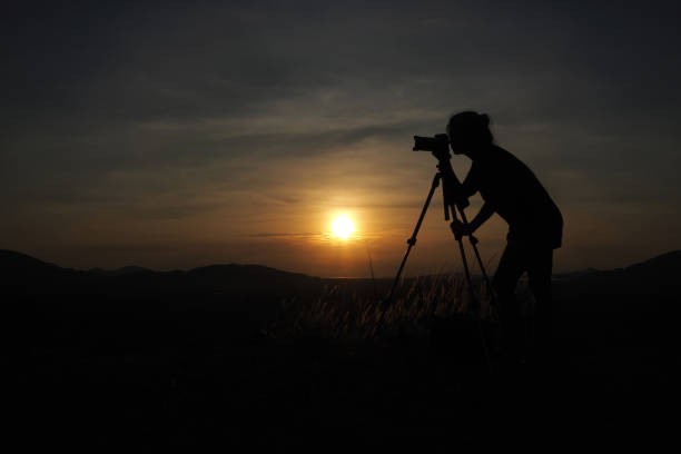 istock Photographer silhouette and sunset 1250184966