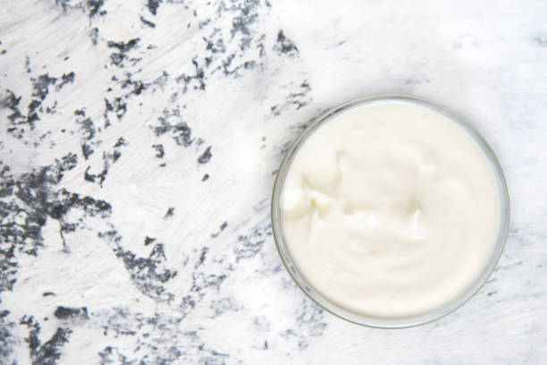 istock Homemade yogurt or sour cream in a bowl 1250187086
