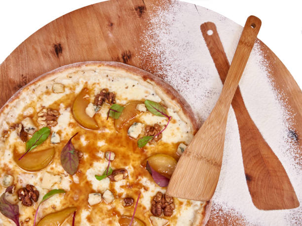 istock Pizza on wood decorated with spreaded wheat 1250190426