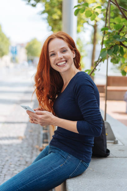 istock Friendly cheerful young redhead woman 1250191338