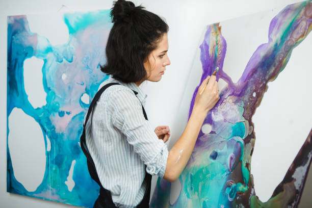 istock Concentrated woman focused on creative art-making process in art therapy 1250191524