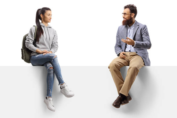 istock Female student sitting on a panel and talking with a bearded man 1250195401
