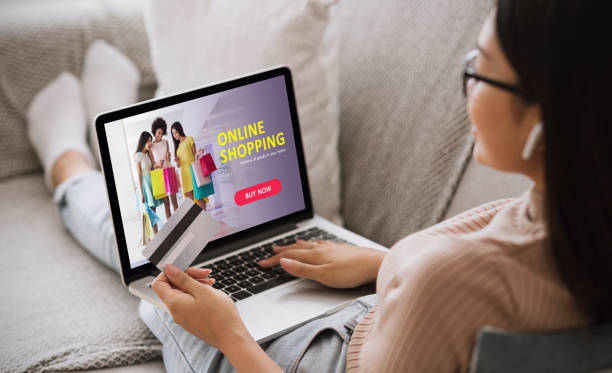 istock Asian girl using laptop, holding credit card 1250195808