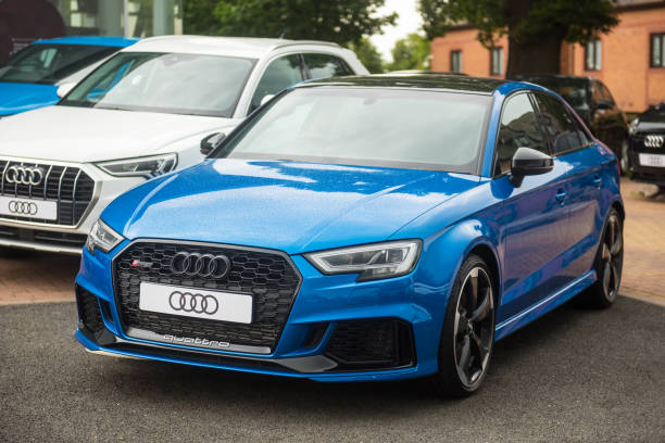 Staffordshire, England - 16 June 2020: A new Audi RS3 Saloon/Sedan on the forecourt at an Audi dealership. The RS3 has a 5-cylinder turbocharged engine with 340 PS.