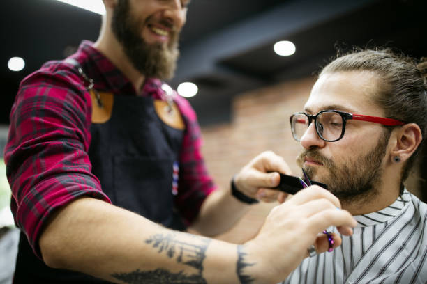 istock Client during beard shaving in barber shop 1250199600