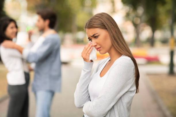 Girl Crying Seeing Boyfriend Hugging Other Woman In Park Infidelity. Sad Girl Crying Seeing Her Cheating Boyfriend Hugging Other Woman In Park. Selective Focus former photos stock pictures, royalty-free photos & images