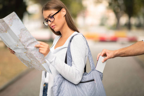 istock Thief Stealing Smartphone From Tourist Woman's Bag Standing Outside, Cropped 1250201984