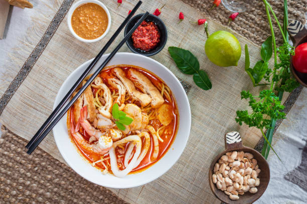 Seafood Curry Laksa. Table top view of Malaysian food. traditional malaysian food stock pictures, royalty-free photos & images