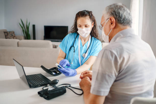 istock Healthcare worker at home visit 1250203749