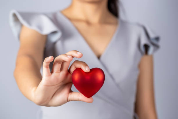 istock Female hand holding red heart, Valentines Concept. 1250205074