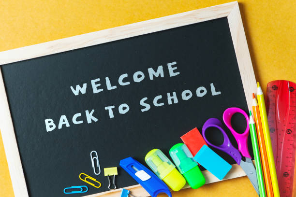 istock School supplies on black board background. Back to school concept 1250205162