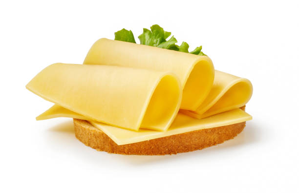 cheese slices with salad leaf on piece of bread. sandwich isolated on white background. - gouda imagens e fotografias de stock