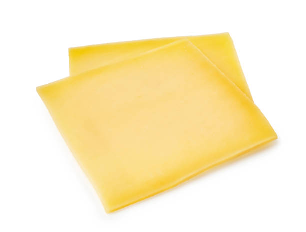 istock Two cheese slices isolated on white background 1250208441
