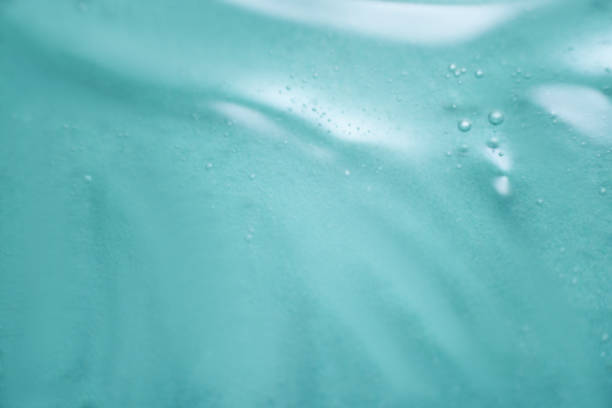 istock Abstract texture. Liquid gel cosmetics. Blue background. 1250208989