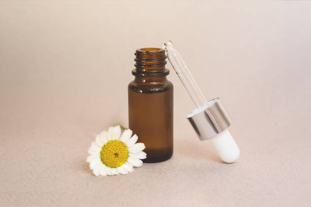 istock A glass dropper bottle on the beige background. 1250212113