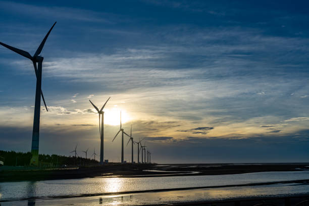istock Gaomei Wetlands Area wind turbines in sunset time 1250214565