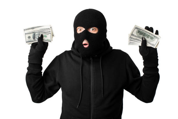 ladrón enmascarado arrestado con los brazos levantados aislados en la pared blanca - burglary thief fear burglar fotografías e imágenes de stock