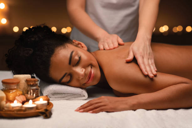 istock Peaceful african woman having back massage at oriental spa 1250218778