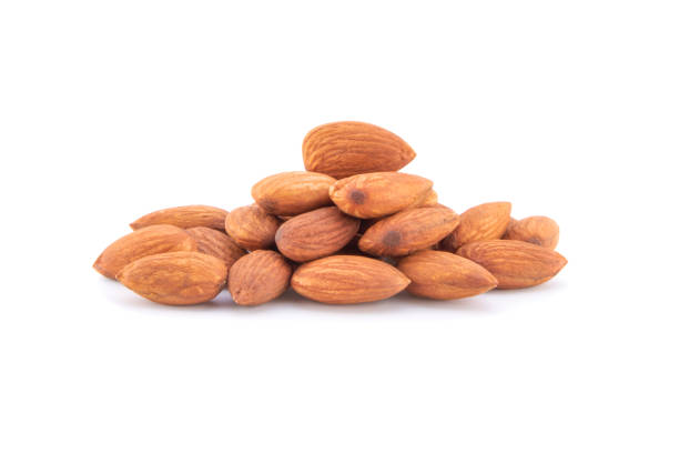 istock Closeup of almonds, isolated on the white. 1250218854