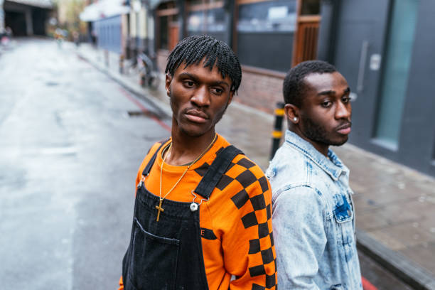 istock Generation-Z black man in with dreadlocks and orange sweater 1250219079