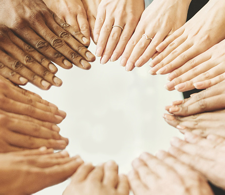 Togetherness Concept. Closeup of hands forming circle, high angle top view, diverse group