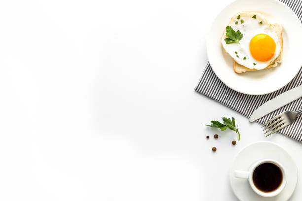 istock Fried eggs sandwich on plate - white background top-down copy space 1250222761