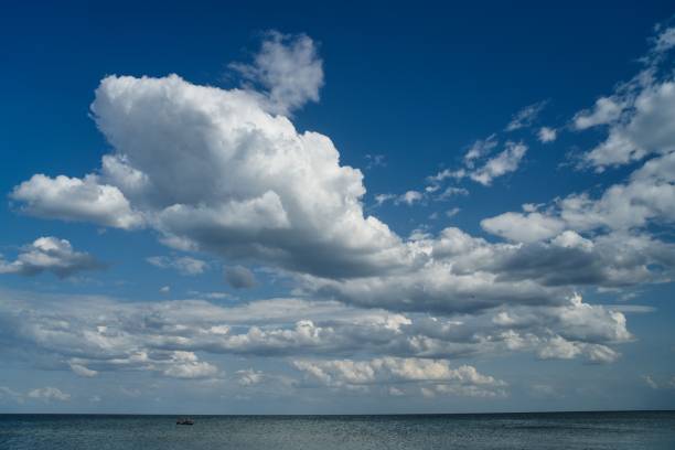 istock white clouds floating in the blue sky 1250225482