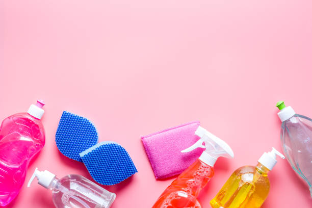istock Detergents for house cleaning on pink table top view copy space 1250227419