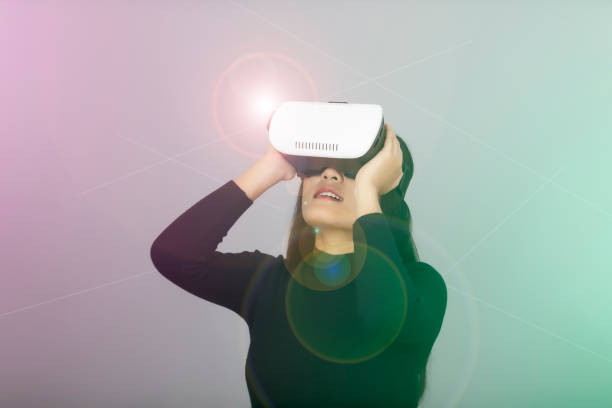 istock Young asian woman using VR device or virtual reality glasses. Excited about the new experience. 1250228111