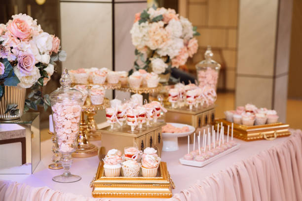 istock Candy bar on table in vase and plate, macaroon, marshmallow, cake and cupcake 1250228181