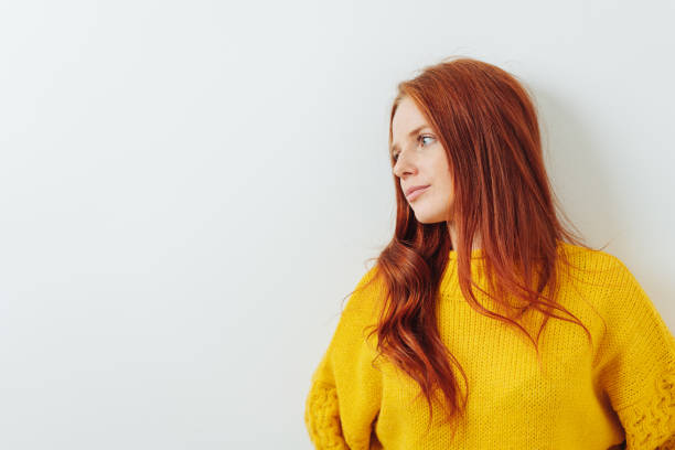 istock Thoughtful depressed young woman leaning on a wall 1250228368