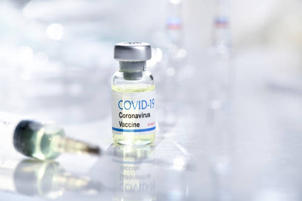 istock Close up of syringe and Coronavirus vaccination 1250229056