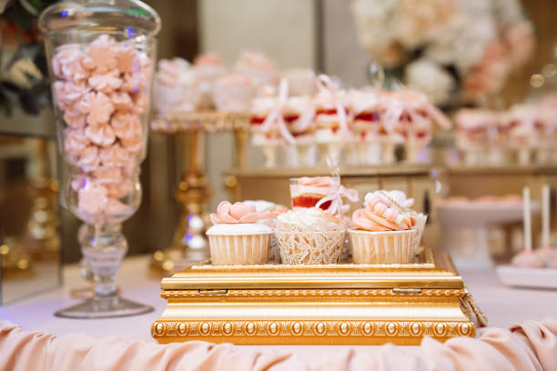 istock Candy bar. Table with sweets, buffet with cupcakes, candies, dessert 1250229308