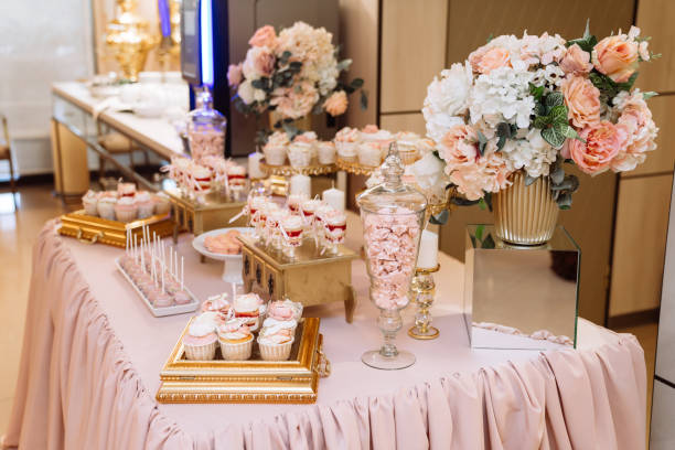 istock Candy bar on table in vase and plate, macaroon, marshmallow, cake and cupcake 1250229937