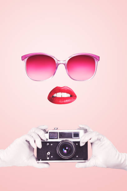 Pop art woman portrait holding vintage film camera Pop art woman portrait holding vintage film camera over pink background pin up girl photos stock pictures, royalty-free photos & images