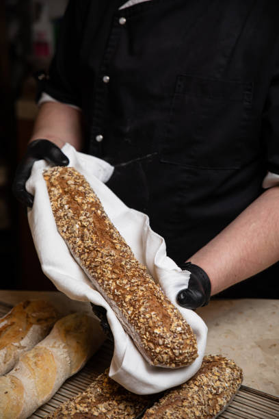 istock the chef is holding a freshly baked hot baguette 1250231230