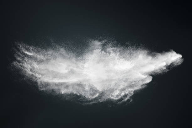 istock Abstract design of white powder cloud on dark background 1250232146