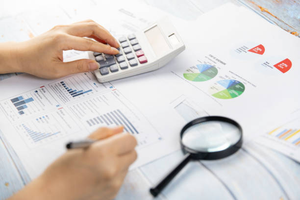 istock I'm working with a calculator and a pen in my hand 1250234407