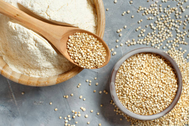 istock Raw white quinoa seeds and flour top view 1250237484