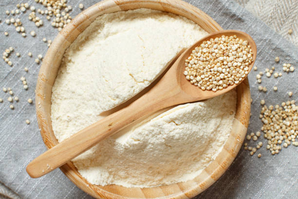 istock Raw white quinoa seeds and flour top view 1250237497