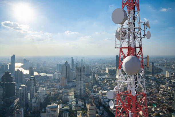 istock Telecommunication tower with 5G cellular network antenna on city background 1250239073