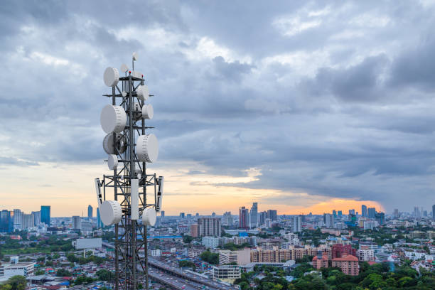 istock Telecommunication tower with 5G cellular network antenna on city background 1250239762