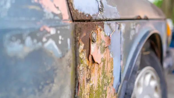 Photo of Close up of abandoned car at the junkyard